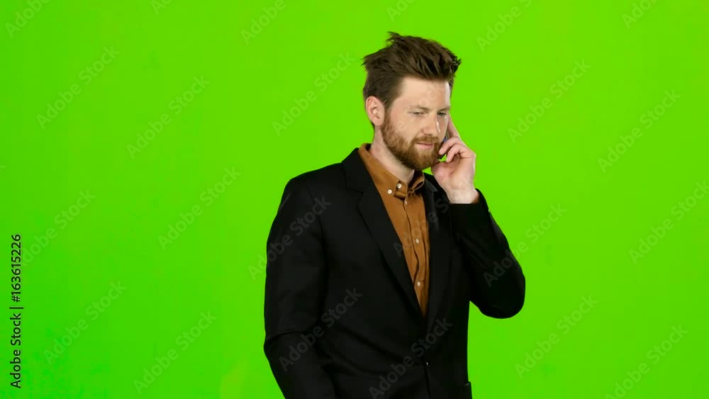 Guy is flirting with his girlfriend on the phone. Green screen Guy is flirting with his girlfriend on the phone. Green screen