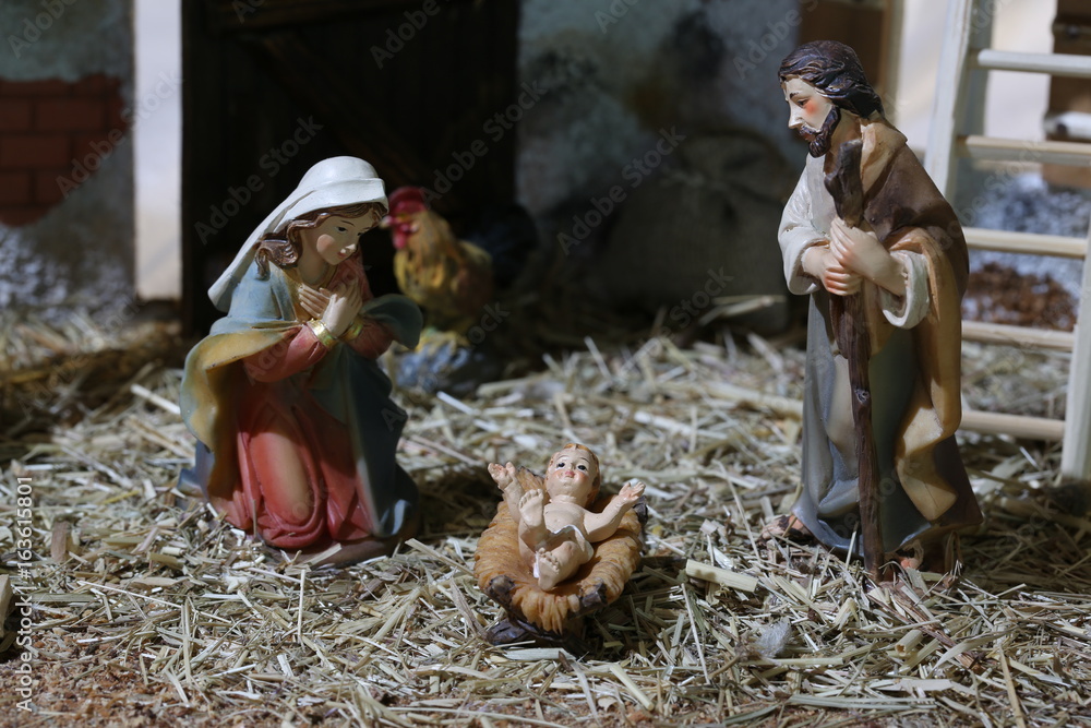 nativity scene with holy family in a stall