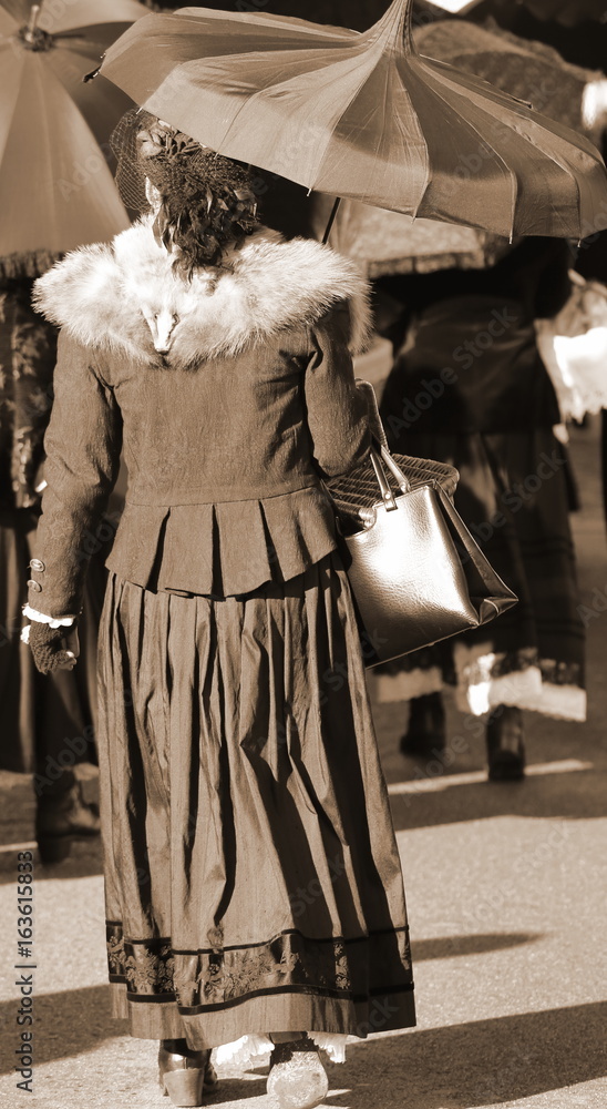 Old ladies dressed in vintage clothes with sepia effect