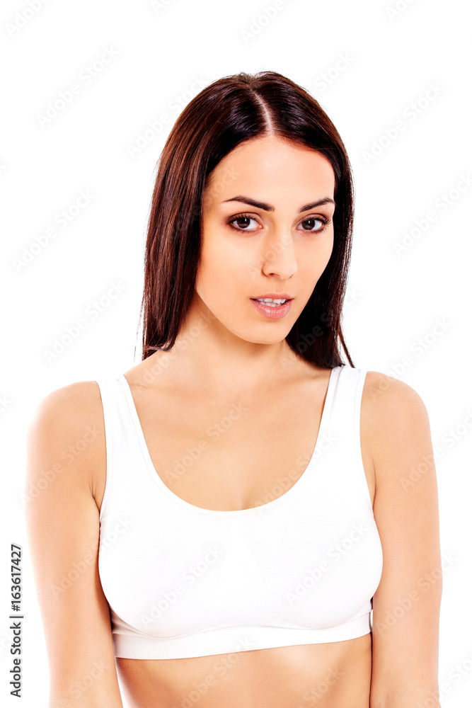 Portrait of beautiful fit girl in bra. Isolated on white. Portrait of beautiful fit girl in bra. Isolated on white.