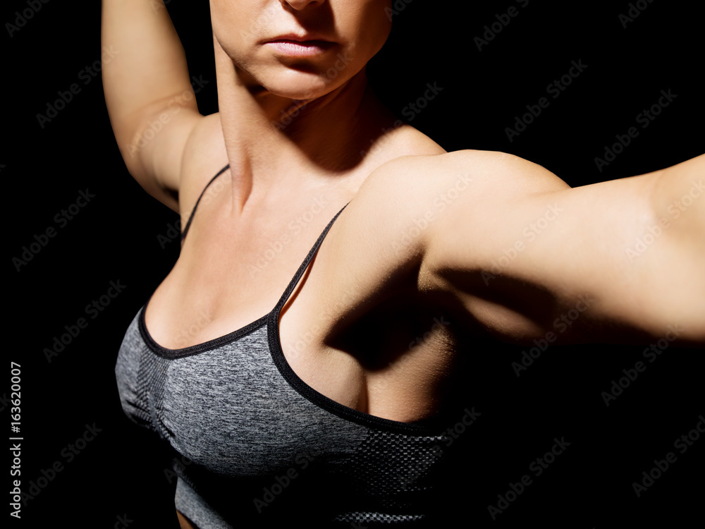 Muscular bodybuilder woman showing her muscles. Muscular bodybuilder woman showing her muscles.