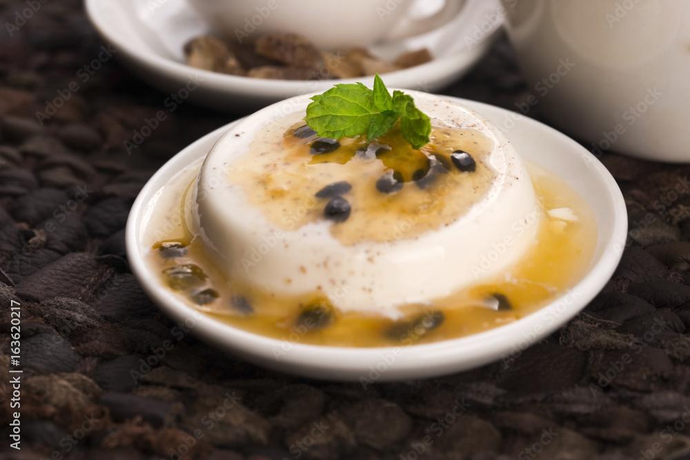 Panna cotta dessert with passion fruit and mint Panna cotta dessert with passion fruit and mint