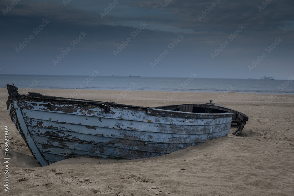 lonely old broken  fishing boats on the beach