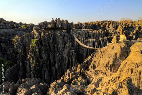 Beautiful HDR view on the bridge over the canyon at the Tsingy de Bemaraha Strict Nature Reserve in Madagascar photo