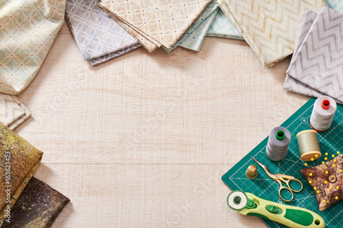Tablou pe pânză Set of pastel fabrics and sewing tools on craft mat