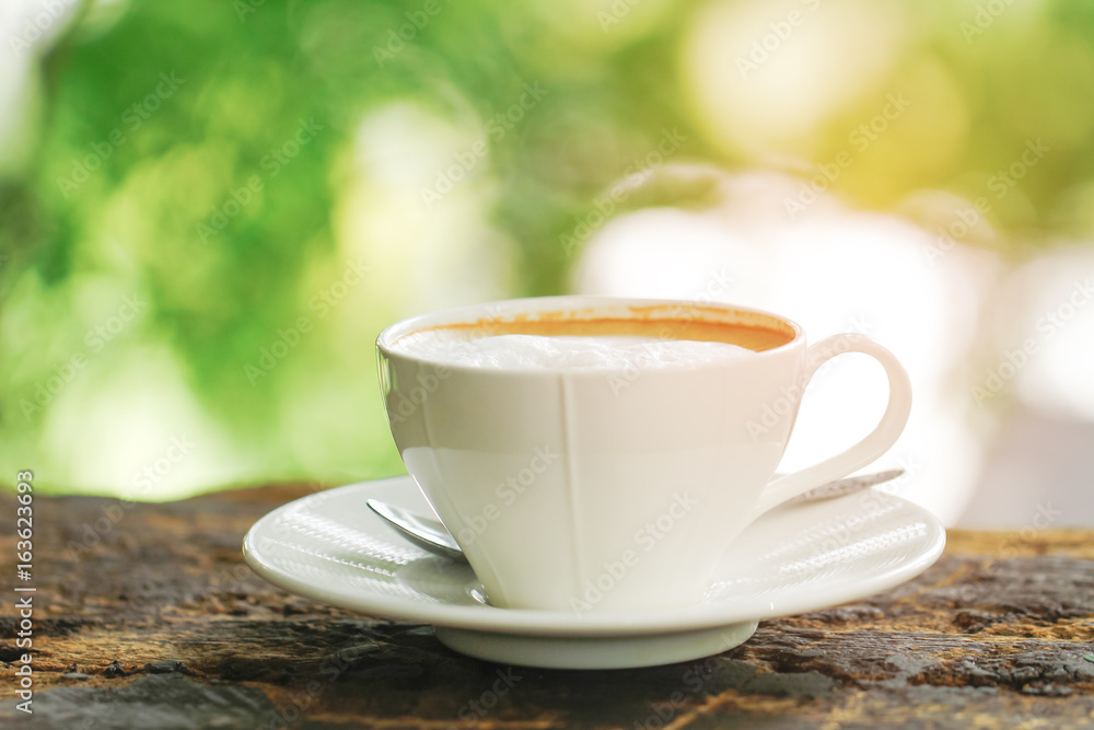 Stock Photo - White Coffee Cup on brown old wooden table with bokeh Stock Photo - White Coffee Cup on brown old wooden table with bokeh