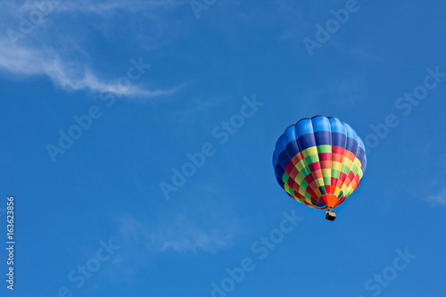 Colorful hot-air balloon in flight