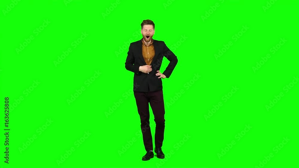 Sleeps a man, yawns, he is sleepy and wants to go to bed. Green screen Sleeps a man, yawns, he is sleepy and wants to go to bed. Green screen