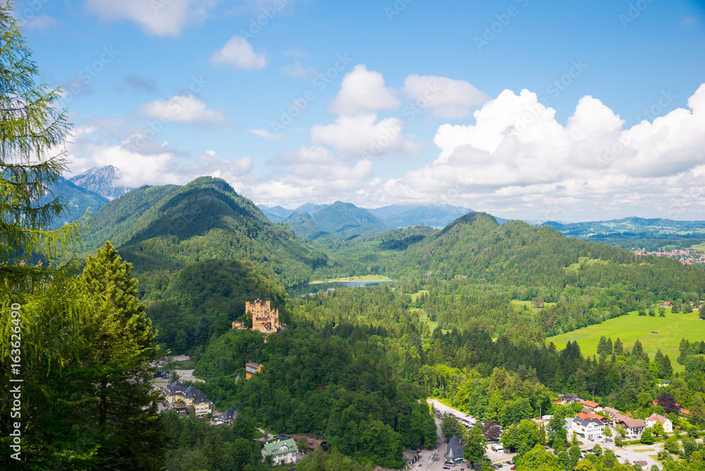 Castle Hohenschwangau, eternal forest with mountains of Bavaria, Germany.