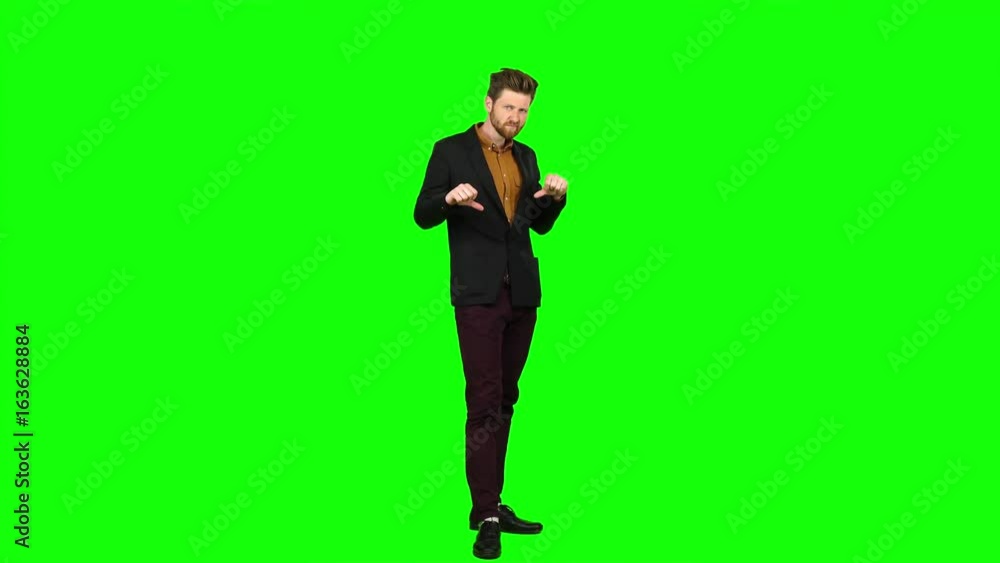 Man watches a movie and punches his finger down. Green screen Man watches a movie and punches his finger down. Green screen