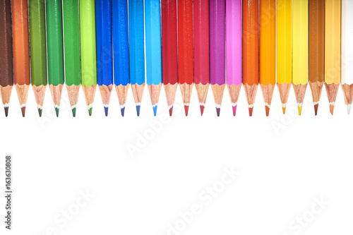Colored Pencils Row Over White Background