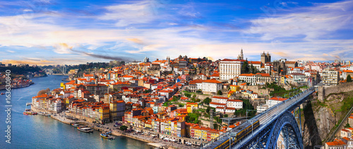 panorama of beautiful Porto over sunset - view with famous bridge of Luis, Portugal photo