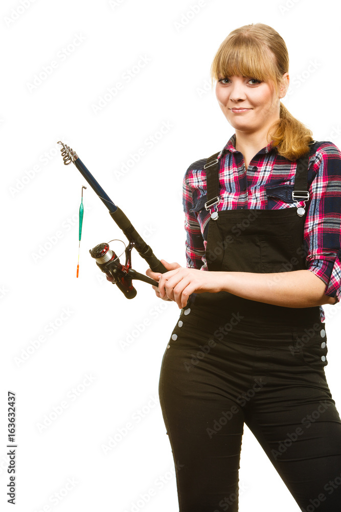 Similing woman wearing check shirt holding fishing rod Similing woman wearing check shirt holding fishing rod