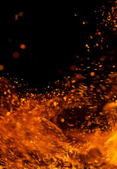 Flame of fire with sparks on a black background