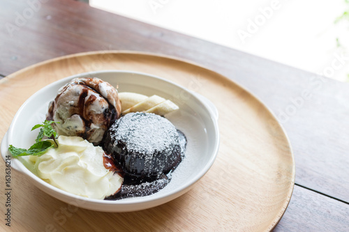 hot chocolate lava cake with vanilla ice cream ball  banana and whipped cream