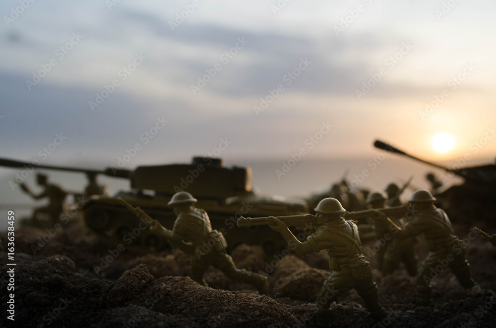 War Concept. Military silhouettes fighting scene on war fog sky background, World War Soldiers Silhouettes Below Cloudy Skyline At night. Attack scene. Armored vehicles. Tanks battle