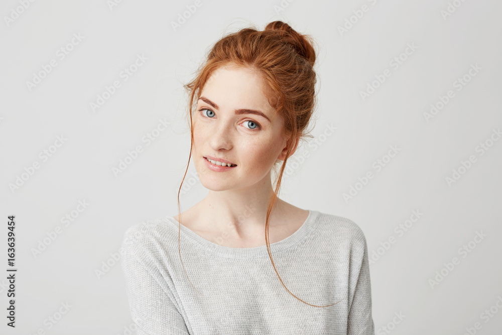 Portrait of beautiful tender redhead girl smiling posing looking at camera over white background. Portrait of beautiful tender redhead girl smiling posing looking at camera over white background.