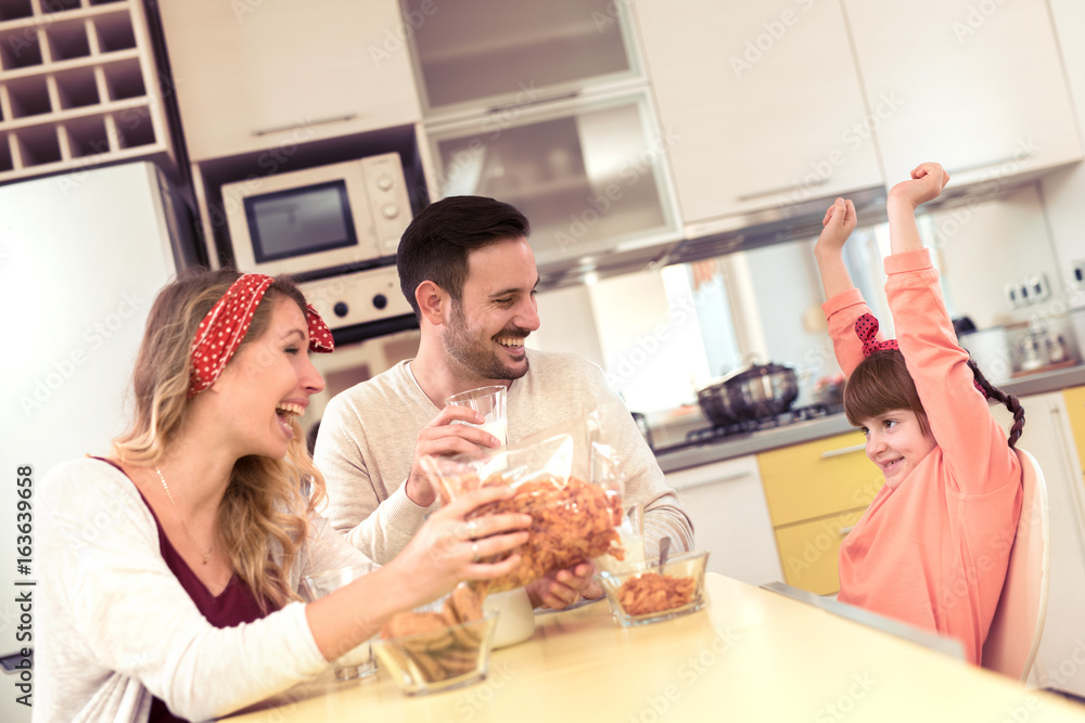 Family having breakfast in kitchen