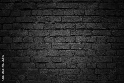 Old brick wall, black background texture