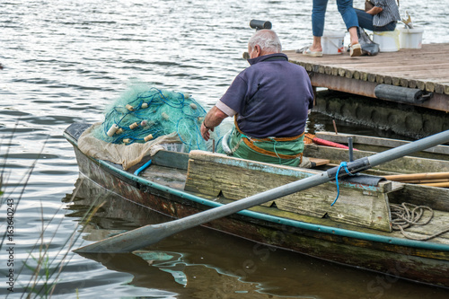 Two fishemen with a small boat, Poti, Georgia photo