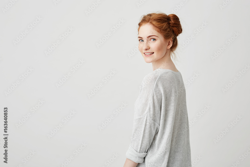 Portrait of cheerful happy pretty redhead girl smiling looking at camera over white background. Portrait of cheerful happy pretty redhead girl smiling looking at camera over white background.