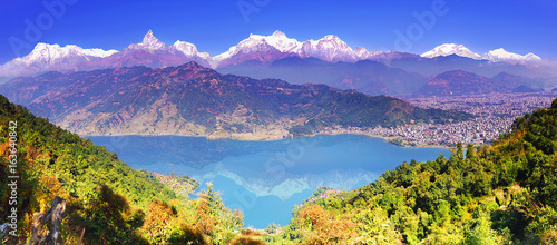 Pokhara valley, Phewa lake and the magnificent Annapurna mountain range from hillside. Himalayas, horizontal panoramic view