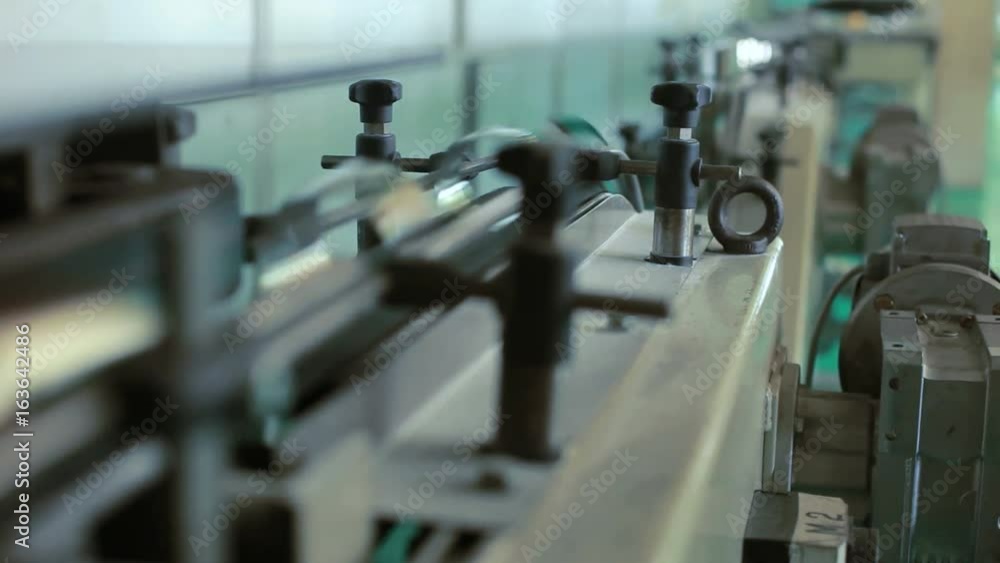 Industrial factory manufacturing machinery. Close up of conveyor line ...