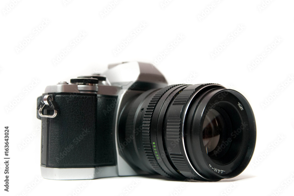 Retro camera with metal lens on white background Retro camera with metal lens on white background