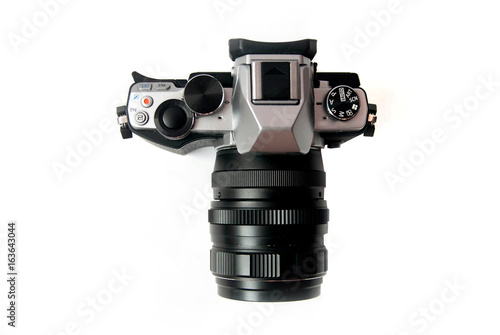 Retro camera with metal lens on white background