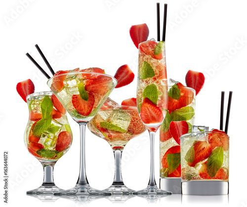fresh fruit alcohol cocktail or mocktail in classic glass with ice, strawberry and mint isolated on white background