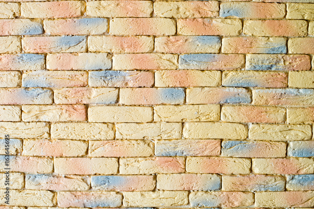 Obraz premium Yellow brickwork as a grunge wallpaper background