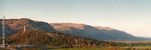 The National Wallace Monument standing on the top of Abbey Craig rock with the Ochil Hills at the background. Stirling, Scotland, UK