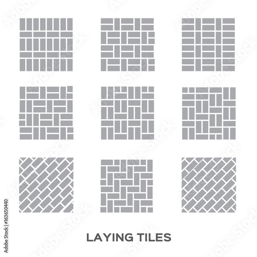 Man tiling a wall in the room