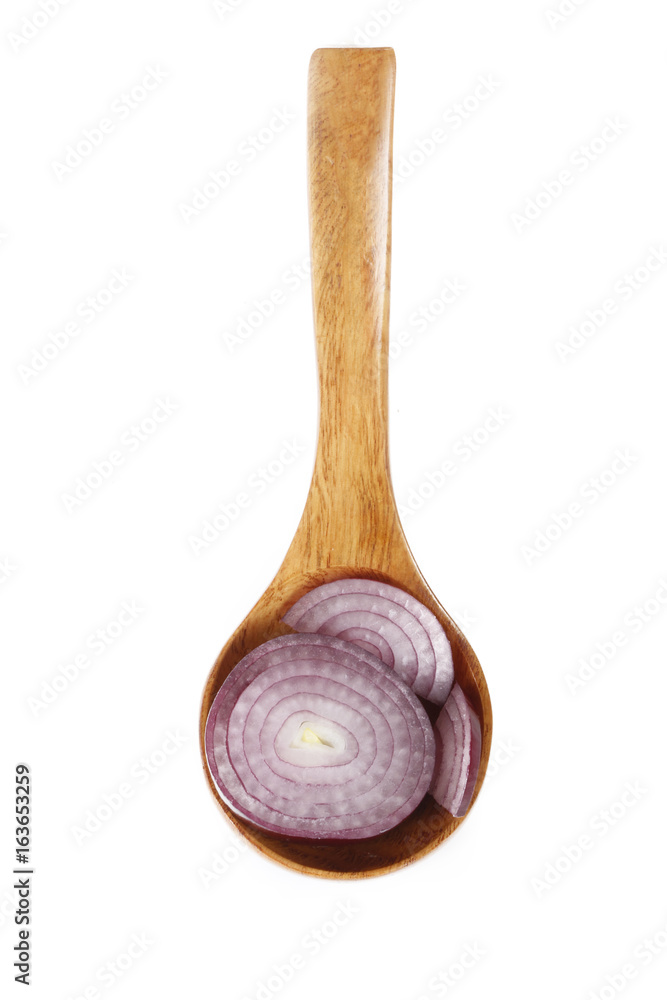 slices of red onion in wooden spoon isolated slices of red onion in wooden spoon isolated