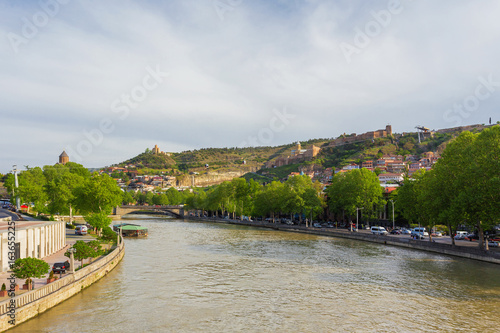 Panorama view on Tbilisi from bridge over Kura river. You can see landmarks - cable road to Narikala fortress. Georgia country.