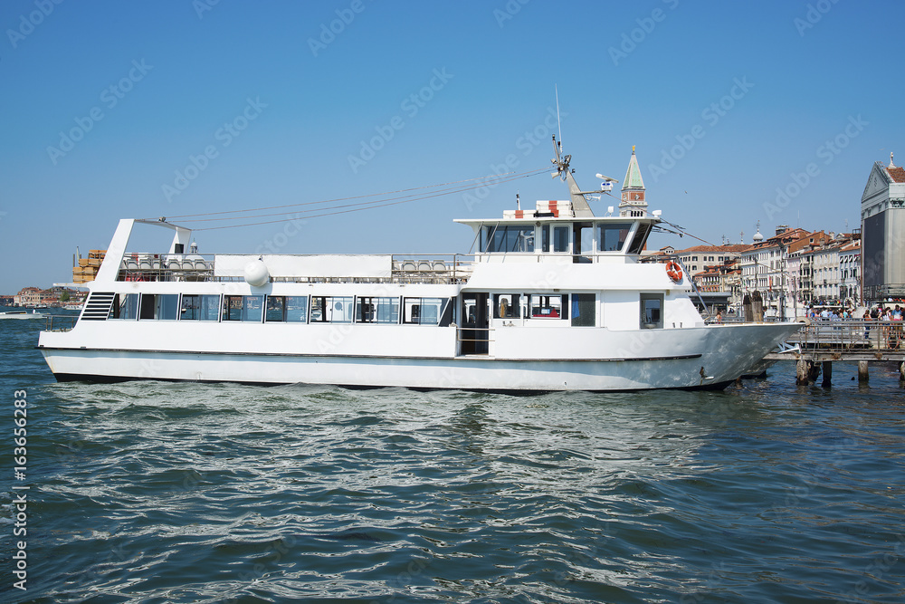 View of the beautiful architecture and boats along the canal in Venice, Italy View of the beautiful architecture and boats along the canal in Venice, Italy