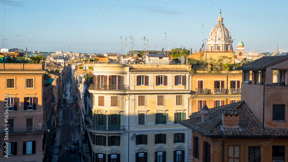 Early sunset view on Rome with San Carlo al Corso dome and piazza di Spagna, Italy