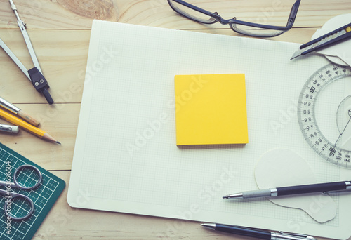 Notepad on work table with elements of tools,equipment.Creativity decoration design and handmade concept