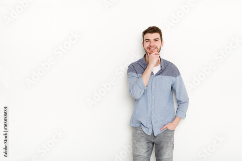 Handsome man posing with hand on chin