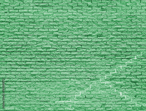 green brick wall background with old cracks and textures