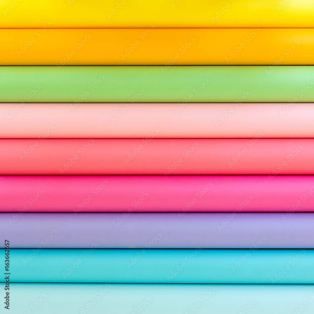 Colorful bright rolls of a paper arranged in a row Colorful bright rolls of a paper arranged in a row