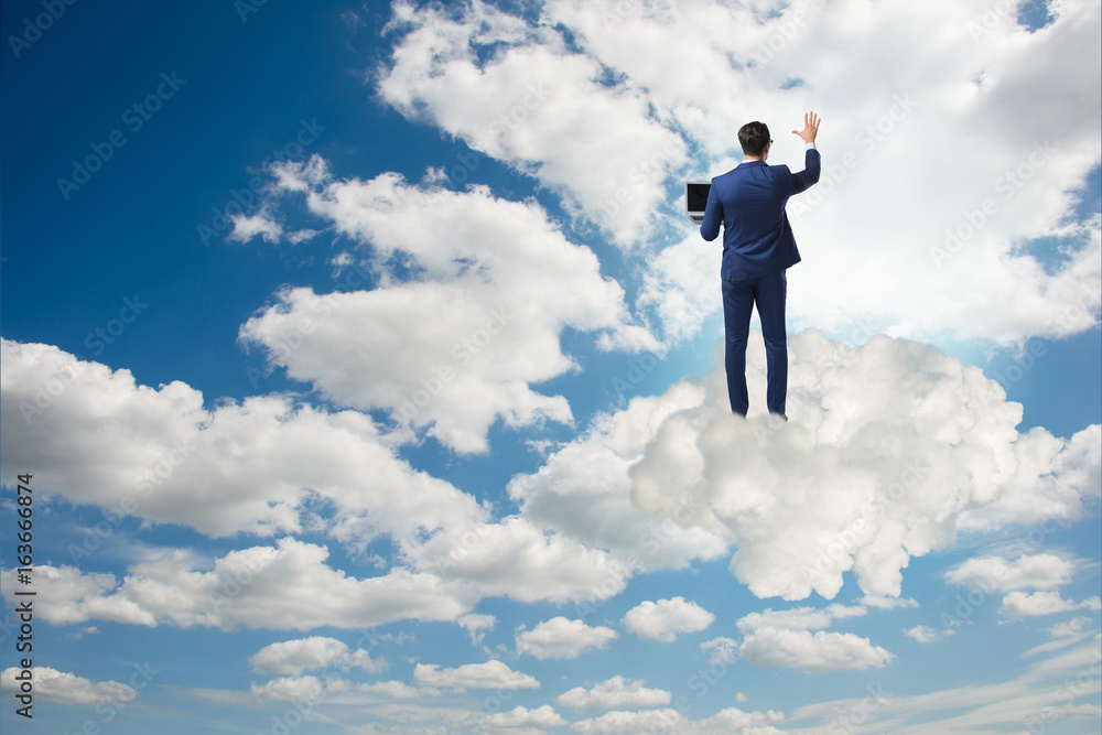 Businessmam pressing virtual buttons in the sky Businessmam pressing virtual buttons in the sky