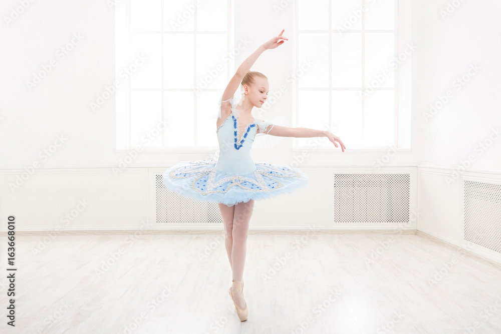 Naklejka premium Ballet student exercising in ballet costume