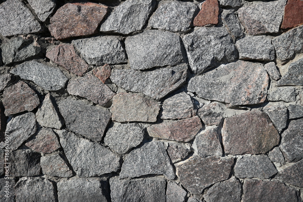 Rubble gray and brown stone wall, rubblework Rubble gray and brown stone wall, rubblework
