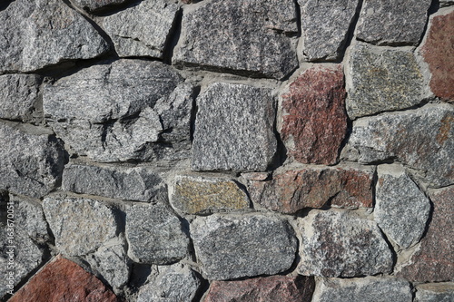 Rubble gray and brown stone wall, rubblework