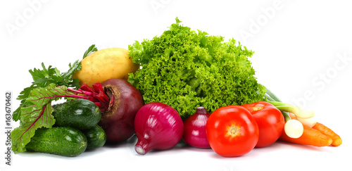 Assortment of fresh raw vegetables isolated on white background. Tomato, cucumber, onion, salad, carrot, beetroot, potato