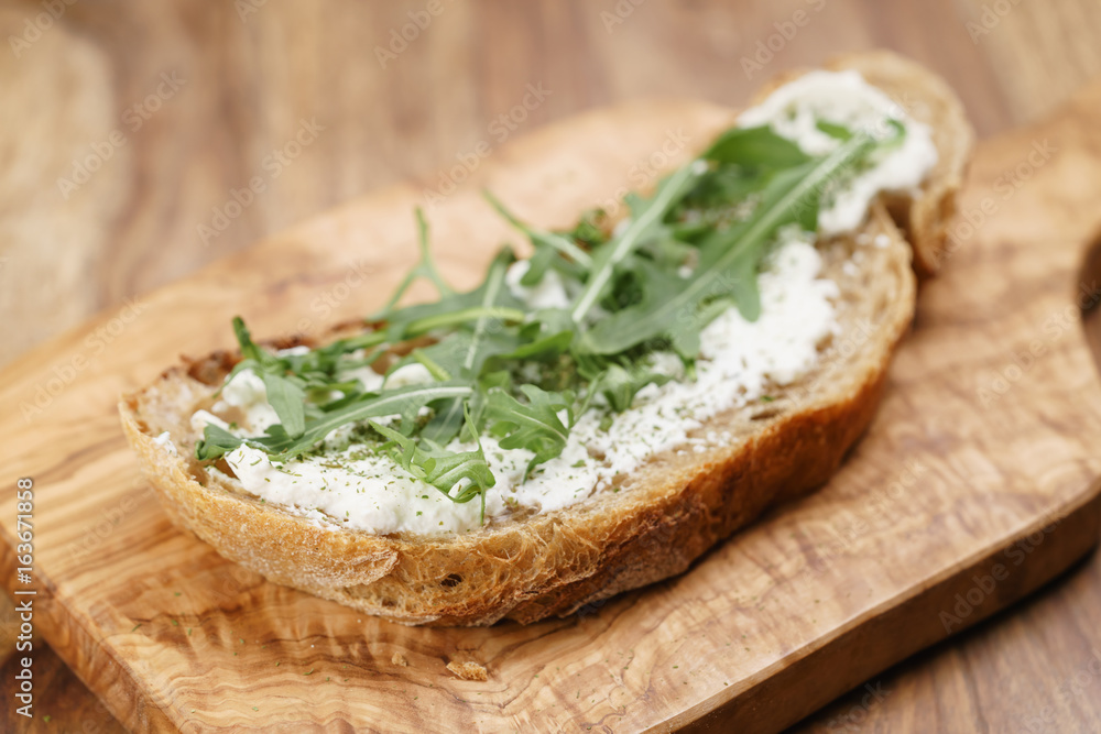 arugula on rustic bread with ricotta cheese arugula on rustic bread with ricotta cheese