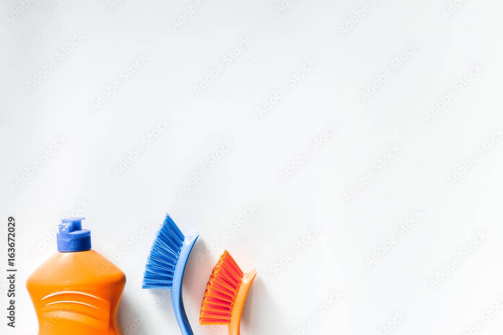 Dishwashing liquid and brushes on white background top view copyspace Dishwashing liquid and brushes on white background top view copyspace