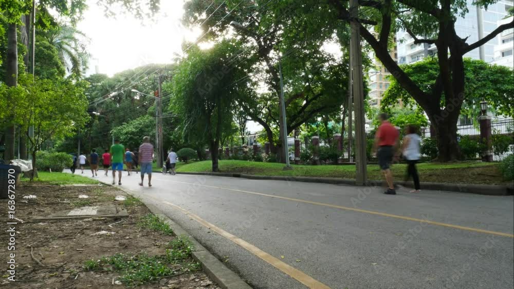 Timelapse of people running in Lumpini Park in Bangkok, Thailand. Timelapse of people running in Lumpini Park in Bangkok, Thailand.