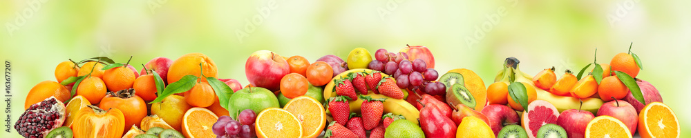 Panoramic wide photo of fresh fruits for skinali on a green background. Panoramic wide photo of fresh fruits for skinali on a green background.